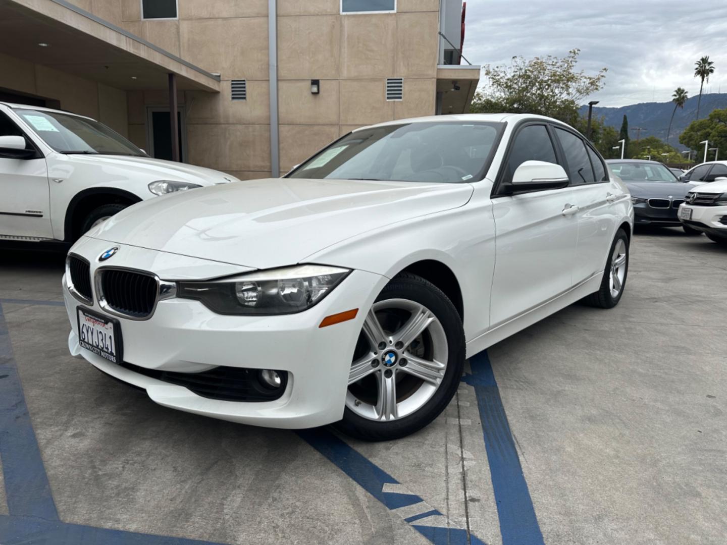 2013 White BMW 3-Series 328i Sedan (WBA3C1C52DF) with an 2.0L L4 DOHC 16V engine, AUTOMATIC transmission, located at 30 S. Berkeley Avenue, Pasadena, CA, 91107, (626) 248-7567, 34.145447, -118.109398 - Crown City Motors is a used “Buy Here Pay Here” car dealer in Pasadena CA. “Buy Here Pay Here” financing, means that when you purchase your vehicle from our dealership, that you make the payments to the dealership as well. We do not need the banks approval to get you approved for a used auto - Photo#2